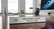 © Kin - Elegant metal nameplate for a Chief Security Officer on a glass desk in a modern corporate office, representing executive leadership, professional authority, and organizational safety oversight.