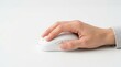 © Matt - Hand using white wireless computer mouse on white desk