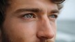 © Thares2020 - Close up portrait of a thoughtful man gazing over the water capturing a profound moment of quiet contemplation by the sea