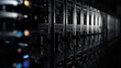 © siraphol - Rack of black server units with moody lighting and reflective highlights
