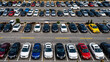 © AI   NEX GEN - Rows of parked cars in a busy outdoor parking lot