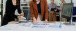 © NINENII - business people collaborate on project analysis with financial graphs. Strategic teamwork and insights drive company growth and success.