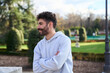 © Oscar - Young man smiling profile in urban park
