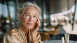 © Natalia - Elegant senior woman enjoying the sun at a city cafe, wearing SPF protection for healthy aging and radiant skin during daily urban life.