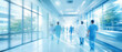 © Rohan Katwe - Modern hospital corridor with doctors and nurses walking in motion blur, bright natural light, clean clinical environment, symbolizing healthcare, emergency care, medical teamwork hospital efficiency