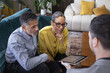 © ReeldealHD images - Senior couple looking at an investment plan with financial advisor