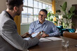 © ReeldealHD images - Business professionals engaged in lively dialogue