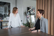 © Николай Амосеев - Two women in business clothing sharing ideas and discussing at worktable in modern well-lit office. Ideas, discussion, teamwork, office, women.