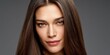 © NovaVision - Beautiful woman with long, straight, dark brown hair and striking green eyes