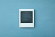 © Rumah - Blank instant photo frame on a textured blue surface