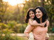 © Someone Cooked Here - indian mother and daughter hugging in warm sunlight representing emotional bonding parenting happiness and family security concept