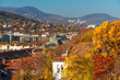© soleg - Breathtaking panoramic view of Budapest Hungary during vibrant autumn season showcasing colorful fall foliage historic architecture and rolling green hills against a bright blue sky