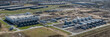 © snapshotfreddy - Large-scale data center campus with extensive computing facilities, dedicated energy supply systems, and advanced cooling infrastructure with extended infrastructure under construction.