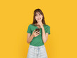 © Designerant - Smiling young woman holding smartphone and touching chin while thinking, imagining idea or message concept. Isolated on bright yellow background with copy space for advertising and marketing use.