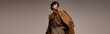© LIGHTFIELD STUDIOS - Handsome stylish man showcases modern fashion in a sleek studio setting