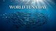 © Being Imaginative - A school of tuna swimming in the ocean on World Tuna Day with sunlight shining through the water