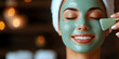 © burntime555 - A woman relaxes with a rejuvenating green facial mask applied with a brush, enjoying a spa treatment