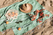 © magic_cinema - Hat, sunglasses, towel, bag, bikini on beach sand background. Summer vacation aesthetic concept. Sunbathing, beach party set, holiday picnic. Travel fashionable blog, social media. Flat lay, top view.