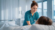 © DebbyMelindaYanti - A dedicated female nurse provides compassionate care to a patient in a bright hospital room. Essential healthcare and medical support