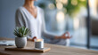 © Kateryna Arkhypova - Person meditating in a home office corner with a plant and candle, stress relief and work-life balance self-care concept, defocused background, with copy space