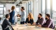 © Hussain - Diverse business team collaborating in a modern office space with natural light and whiteboard