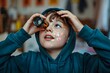 © Hassan - Futuristic Kid Exploring Science with Kaleidoscope and Light Patterns