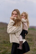 © Iuliia Versta/Stocksy - Cozy moments of mother and daughter outdoors