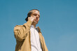 © Maryanne Gobble/Stocksy - Man Talking on Mobile Phone Outdoors