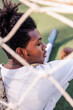 © Jovo Jovanovic/Stocksy - Soccer player rests behind the net