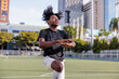 © Jovo Jovanovic/Stocksy - Soccer player jumping during warm-up