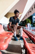 © Jovo Jovanovic/Stocksy - Rugby players prepares for game at the stadium seats