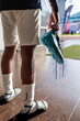 © Jovo Jovanovic/Stocksy - Athlete holding cleats after a game