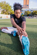 © Jovo Jovanovic/Stocksy - Athlete stretching before practice