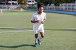 © Jovo Jovanovic/Stocksy - Athlete warming up on a field