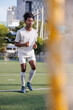 © Jovo Jovanovic/Stocksy - Young Black athlete warming up on a field
