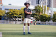 © Jovo Jovanovic/Stocksy - Confident athlete stands in the middle of the field
