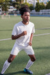 © Jovo Jovanovic/Stocksy - Soccer player running drills on field