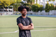 © Jovo Jovanovic/Stocksy - Proud young Black athlete on field