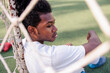 © Jovo Jovanovic/Stocksy - Sad young soccer player