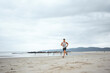 © Artcore Studio/Stocksy - Beach run in the clouds