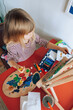 © AUDSHULE/Stocksy - Kid painting with colours