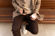 © Alba Studio/Stocksy - Man Using Phone On Bench