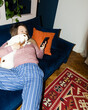 © Asya Molochkova/Stocksy - Overhead Flash Shot of Woman with Cavalier King Charles Spaniel