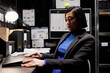 © DC Studio - Accountancy asian employee clocking out from work, shutting down laptop in business office. Bookkeeper executive in archival depository filled with cabinet, folders and flowcharts