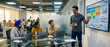 © CGI STOCKS - Indian male project manager leading an agile team meeting presenting a digital Kanban board on a large screen in a modern diverse corporate office.