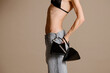 © UM STUDIO/Stocksy - Slim Model With Black Geometric Handbags