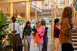 © VICTOR TORRES/Stocksy - Diverse group of professionals in modern office