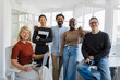 © BONNINSTUDIO/Stocksy - Startup team standing together in modern office setting