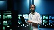 © DC Studio - IT developer in server room using laptop to find network issues affecting supercomputer performance and connectivity, leading to slow data transfer rates and poor client communication