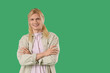 © Pixel-Shot - Young blonde man smiling on green background